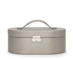 Closed Heritage Oval Jewelry Box showcasing the textured Pewter Saffiano plant-based materials exterior, integrated top carry handle, and a polished chrome push-lock closure.