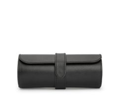 Front profile view of the closed black Heritage Watch Roll, highlighting its cylindrical shape, clean perimeter stitching, and secure closure strap.