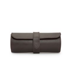 Front profile view of the closed brown Heritage Watch Roll, highlighting its cylindrical shape, clean perimeter stitching, and secure closure strap.