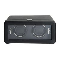 Windsor Heritage Double Watch Winder shown from a straight front view, featuring a closed wide rectangular door with a long glass viewing window framed in textured black material, revealing two side-by-side watch cuffs inside.