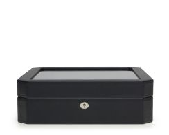 Front profile view of the closed black Windsor 15 Piece Watch Box, showcasing its distinct octagonal beveled corners, clean black stitching, and a polished silver key-lock mechanism.