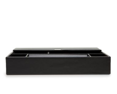 Heritage Valet Tray in smooth black plant-based materials, shown from a straight front view with its rear lid flipped open, displaying a low-profile rectangular silhouette.