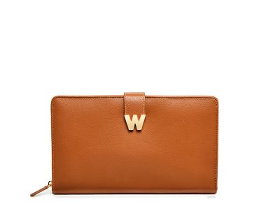 Tan leather travel jewellery portfolio with gold-tone W shape clasp, front exterior view.
