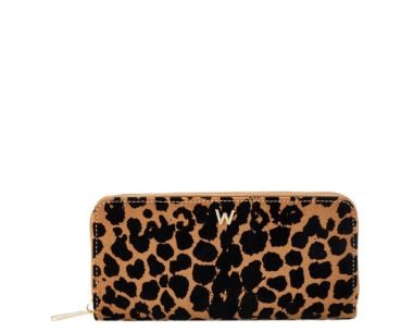 Front view of the WOLF Savanna Leopard Print Long Zip Wallet in tan and black, showing the bold leopard print exterior and gold-finish zip pull.