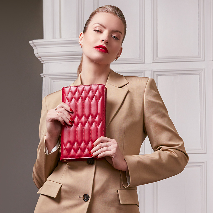 model holding caroline jewellery portfolio in red model holding caroline jewellery portfolio in red