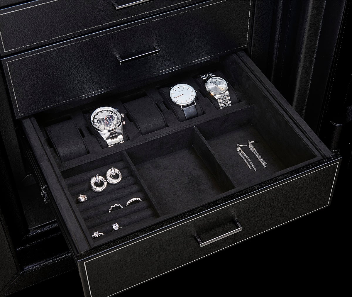 Athos Safe storage drawer with watch and jewellery organisation. Close-up of an Athos Safe storage drawer featuring watch compartments, jewellery storage sections and accessory organisation.