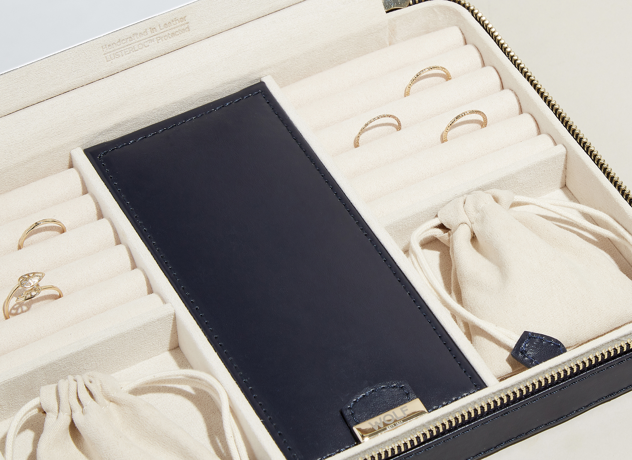 WOLF jewelry zip case interior shot highlighting storage compartments WOLF jewelry zip case interior shot highlighting storage compartments