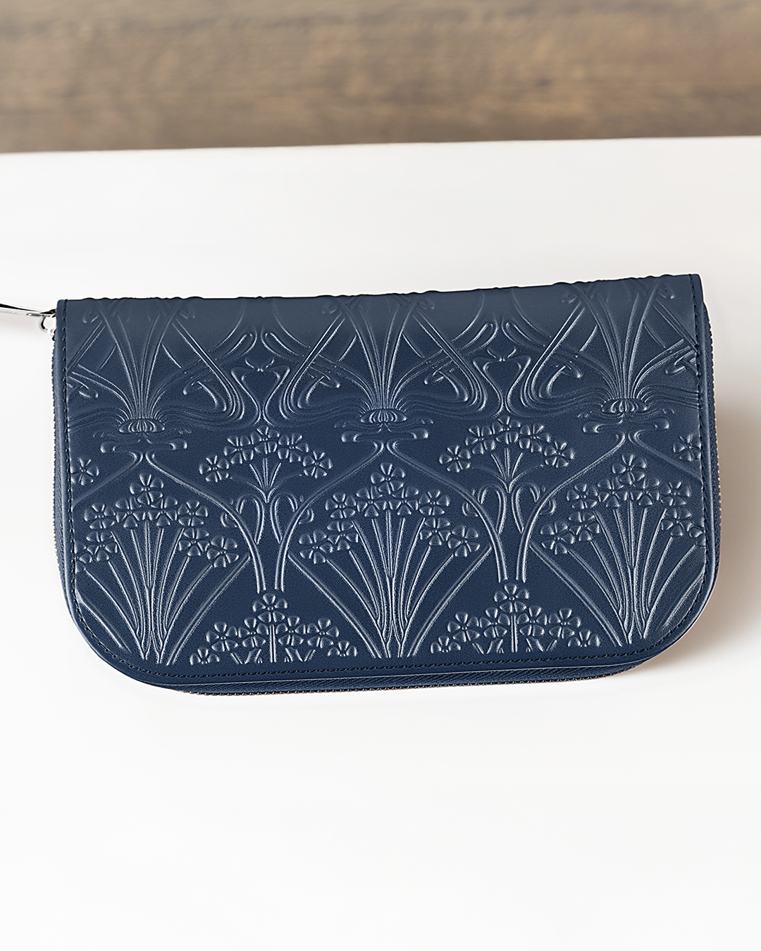WOLF x Liberty Jewelry Portfolio. WOLF x Liberty Jewelry Portfolio in blue, showing the embossed floral exterior and slim fold-over design.